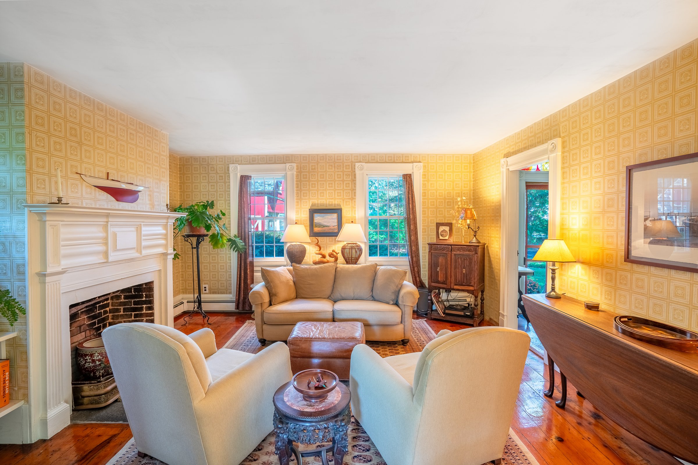 Driveway approach with red carriage house