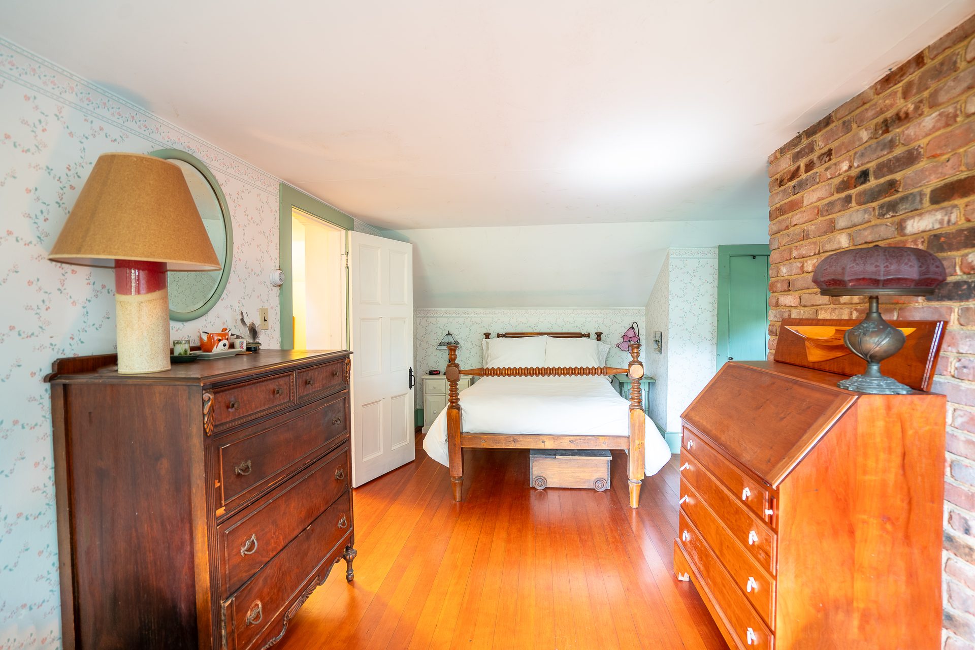 Upper bedroom under the eaves with hand-hewn rafters