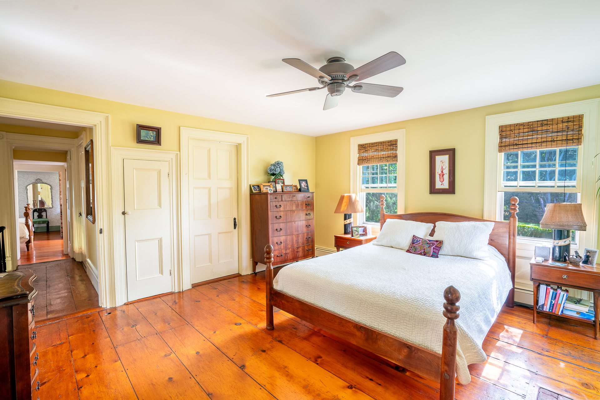 Bedroom showing original wide-plank pumpkin pine