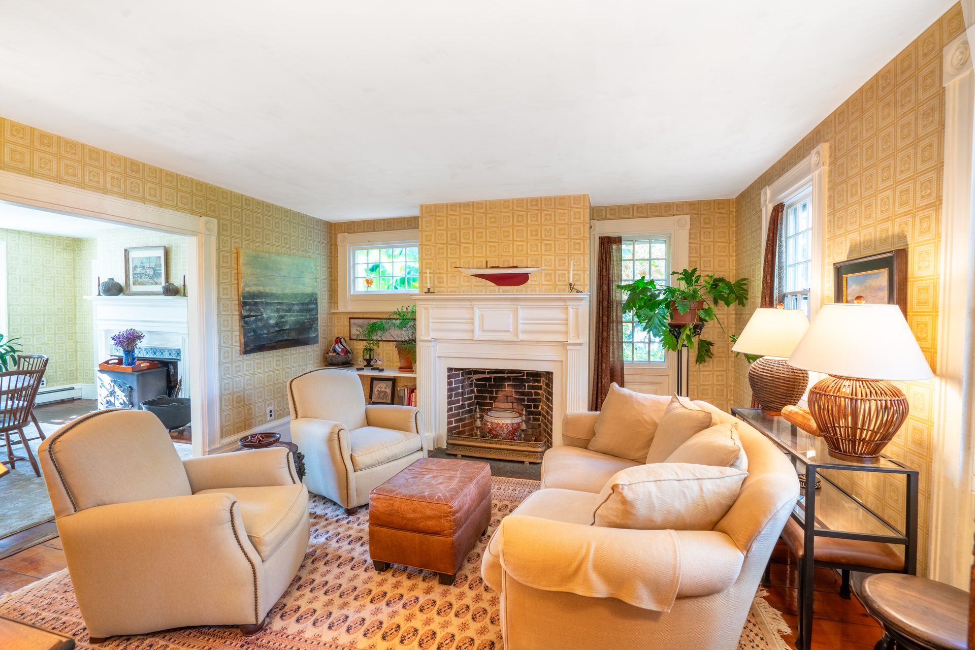 Bedroom with white-mantel fireplace