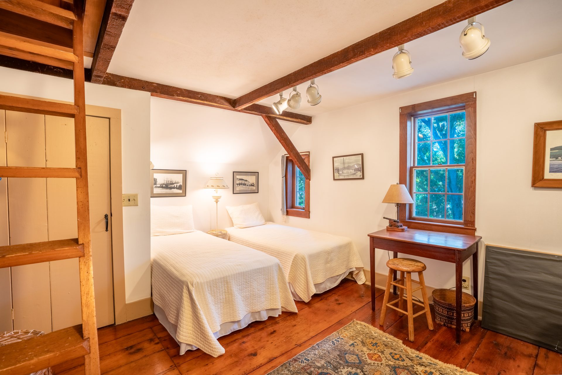 Twin bedroom with ladder to loft