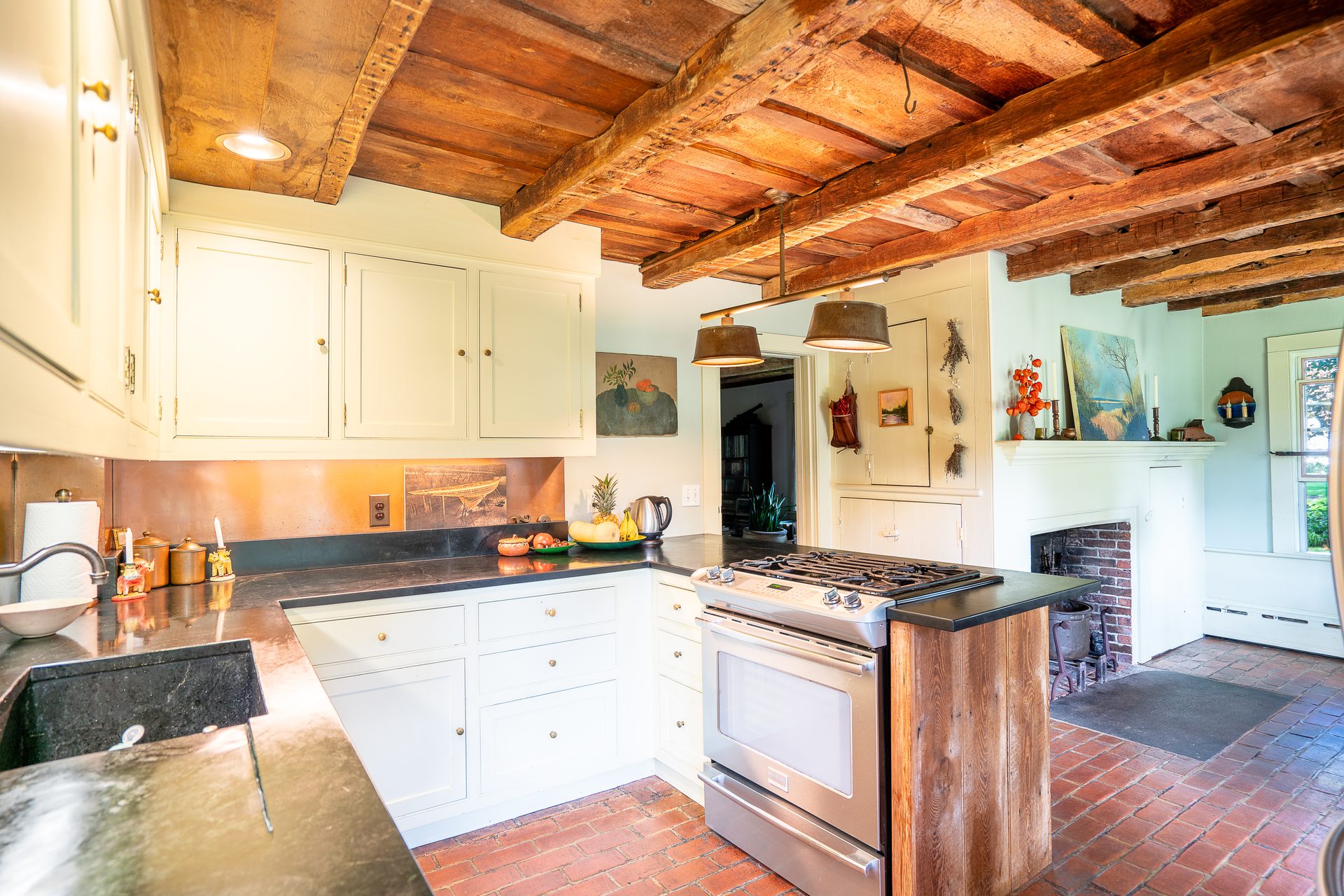 Kitchen with gas cooktop and exposed beams